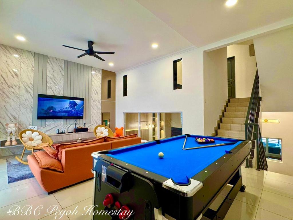 a living room with a pool table in it at BBC Pegoh in Ipoh