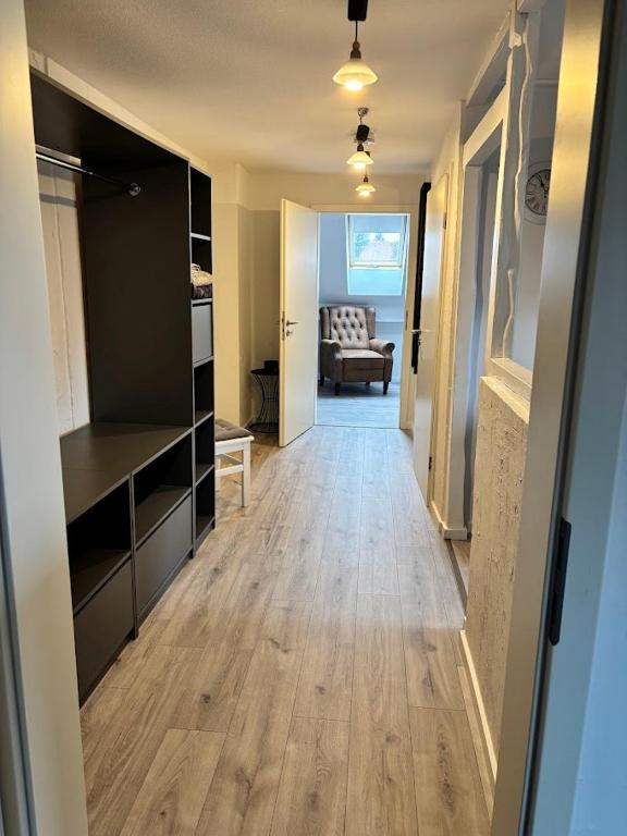 a room with a hallway leading to a living room at gemütliche Ferienwohnung in Burgstaedt