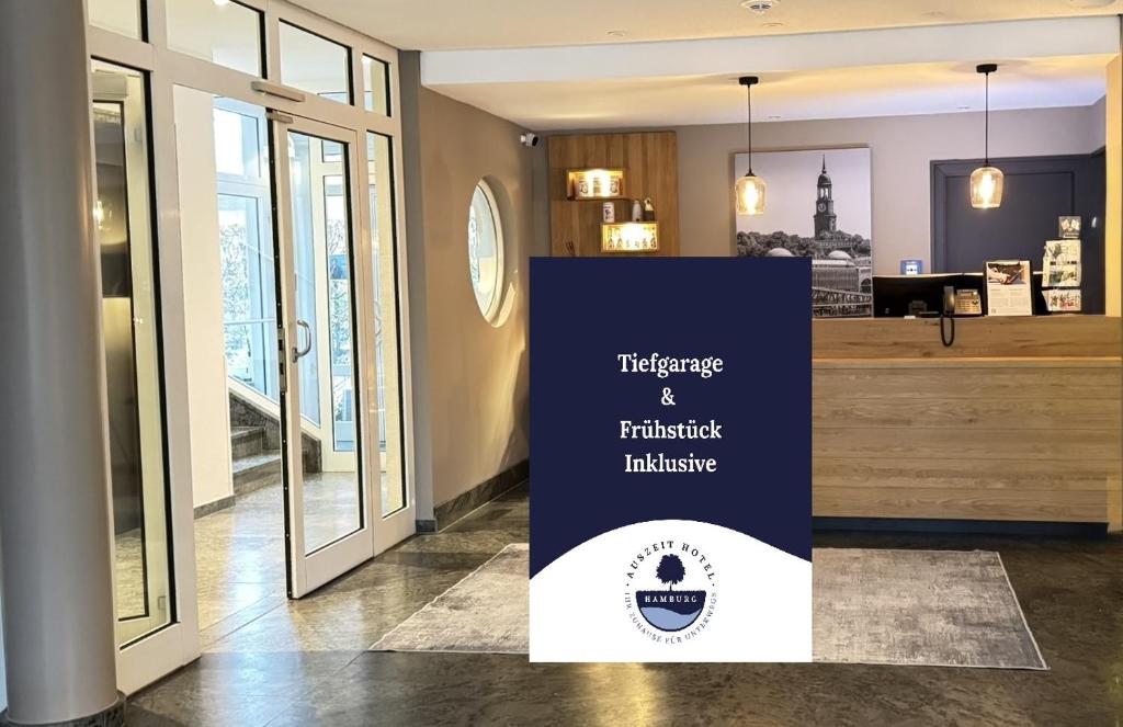 a sign sitting on the floor in a room at Auszeit Hotel Hamburg in Hamburg