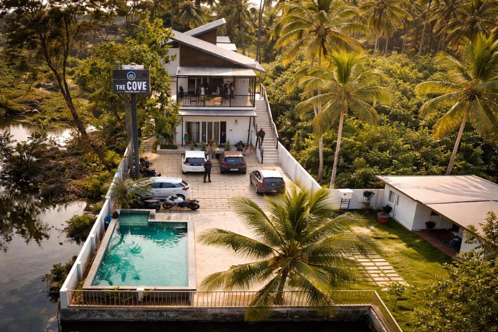 an aerial view of a house with a swimming pool at The Cove Beach Resort in Cochin