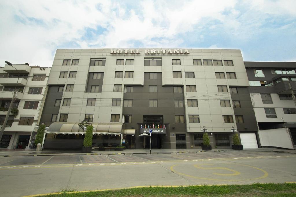 a large white building with the words hotel transmitter at Hotel Britania San Borja in Lima