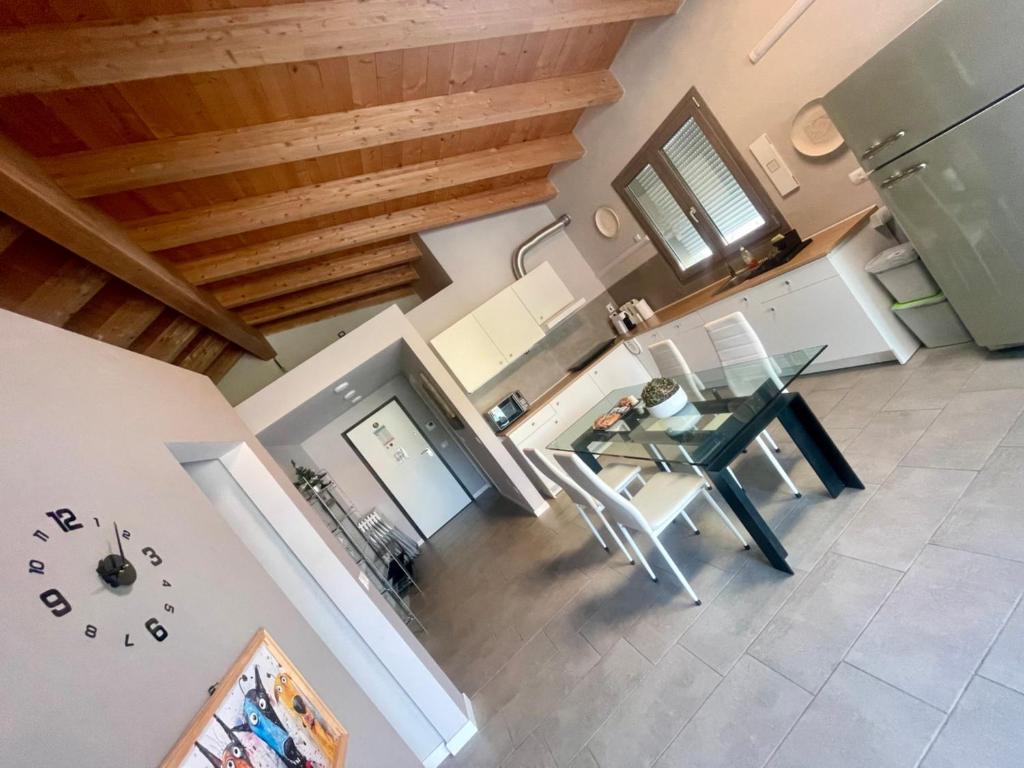 an overhead view of a kitchen and dining room with a glass table at Polly house in Lodi