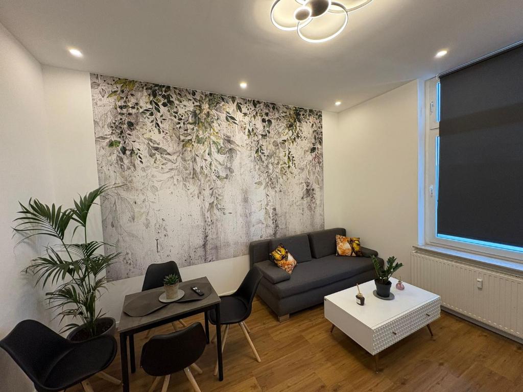 a living room with a couch and a table at Apartament Modern Herne 3 in Herne