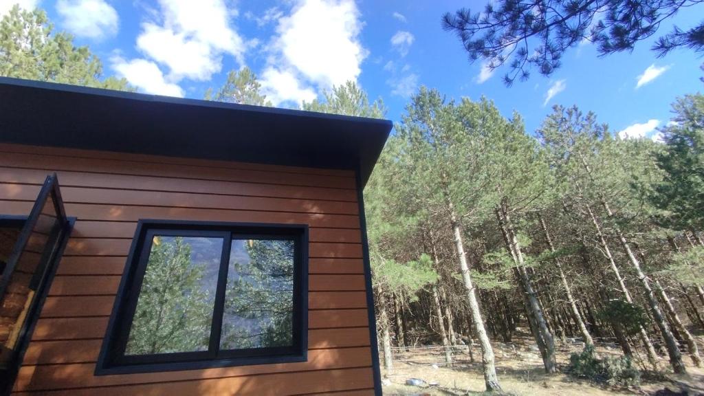 a view of the side of a house with a window at Vruçaj' s Cabin in Bogë