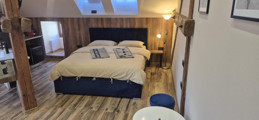 a bedroom with a large bed in a room at URBAN APARTHOTEL Medias in Mediaş