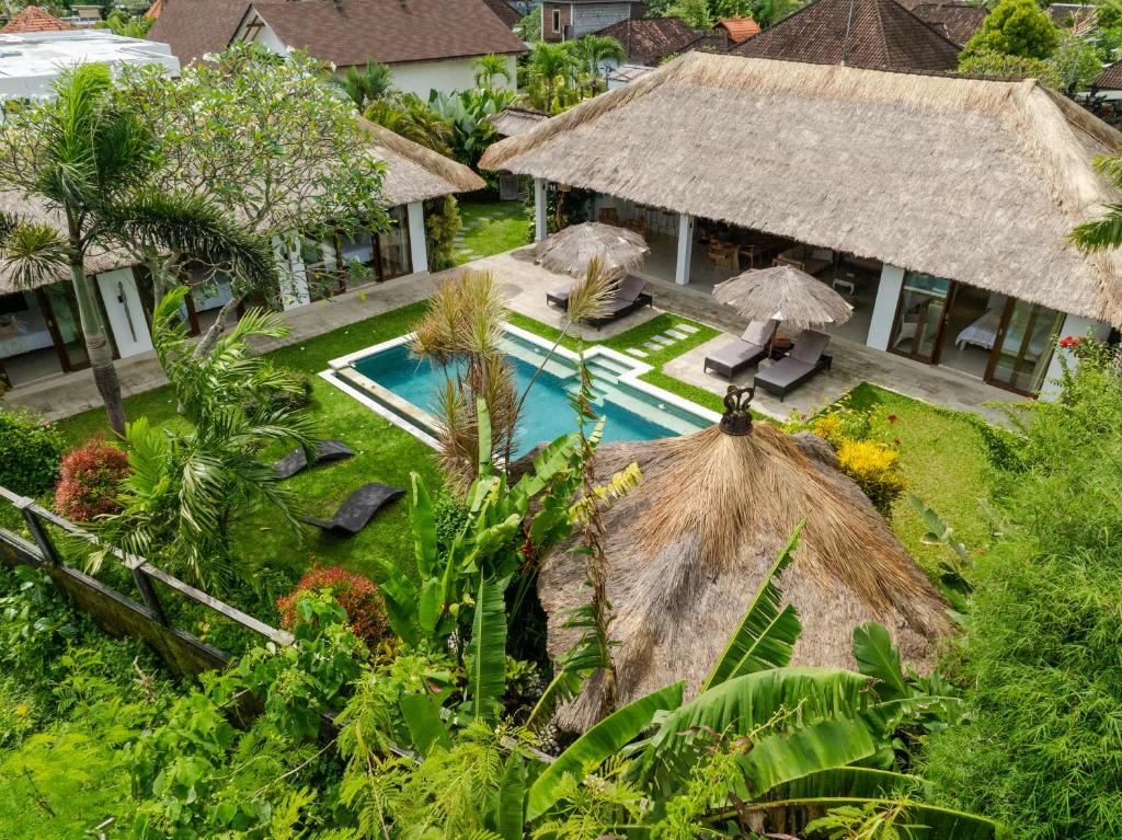 an aerial view of a house with a swimming pool at Villa Pascaline in Mengwi
