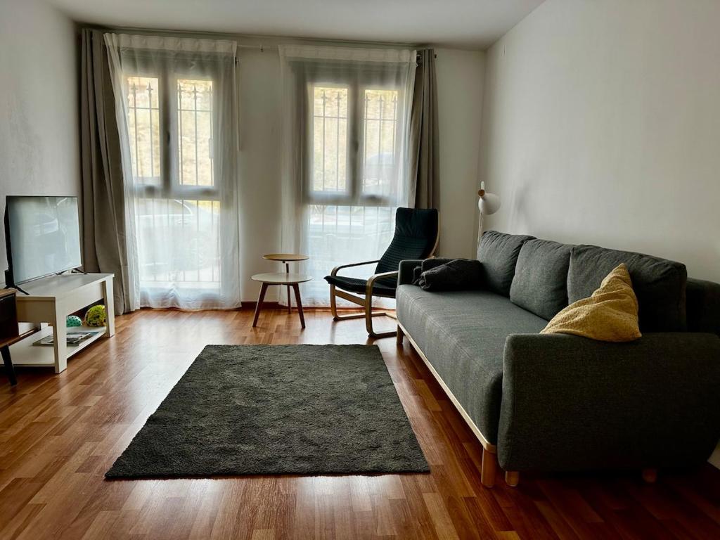 a living room with a couch and a rug at Valdelinares 365 in Valdelinares