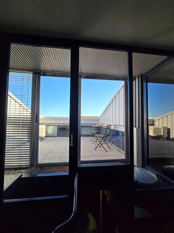 a view of the ocean from a room with three windows at Residenza 404 in Ivrea