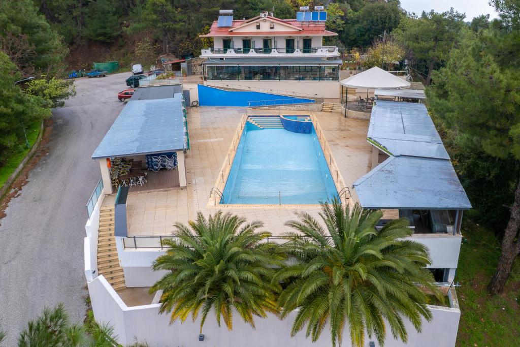 an overhead view of a swimming pool on a house at Apolis hotel in Mouzaki