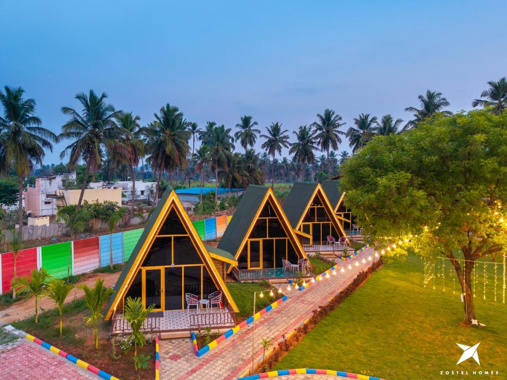 a rendering of a resort with triangular dwellings at Zostel Homes Hampi in Hampi