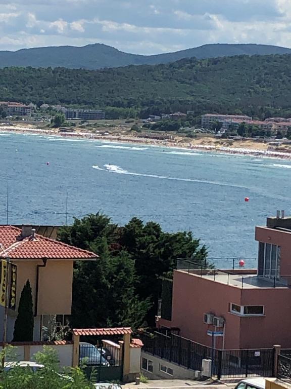 a view of a body of water with a building at Villa Rocky in Sozopol