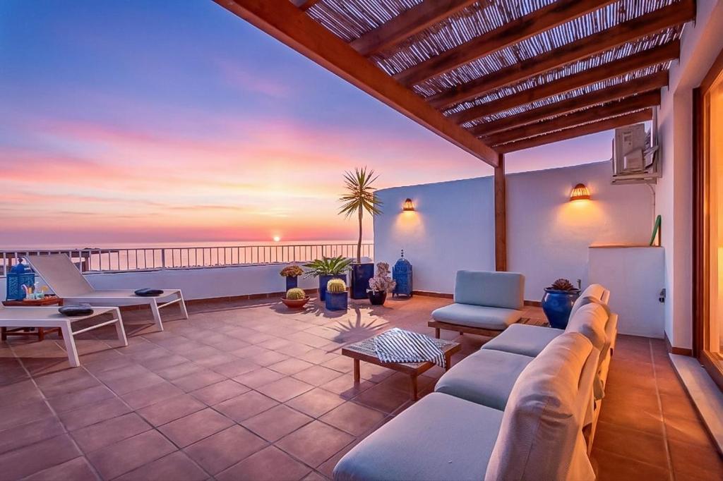a living room with a view of the ocean at Rincón de Hada in Mojácar