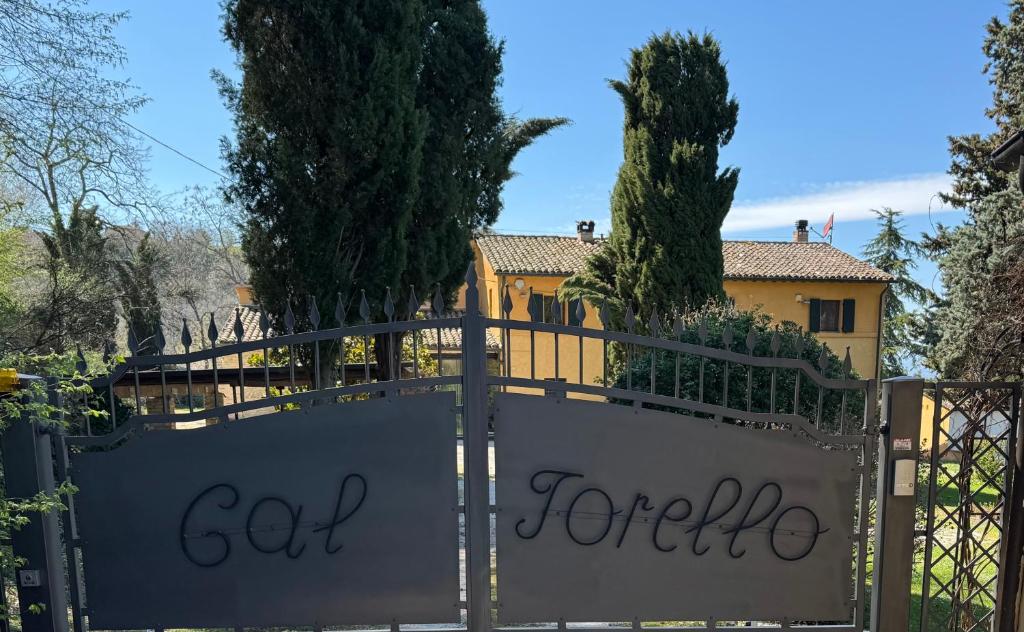 a gate with the words god sent for life written on it at B&B Cal Torello in Urbino