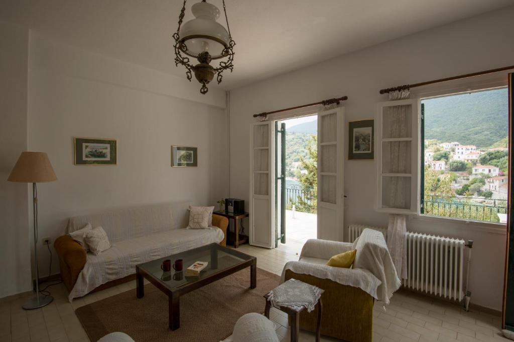a living room with a couch and a table at Costa's House in Kiónion