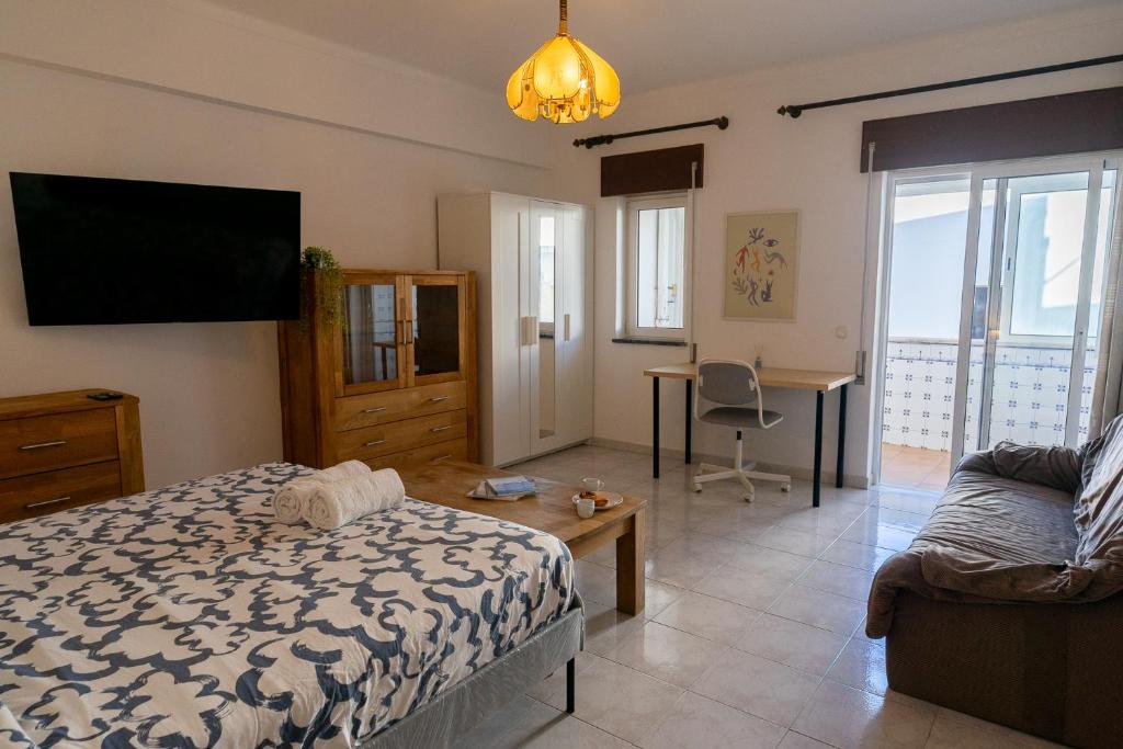 Large room with private lounge area, work space and balcony