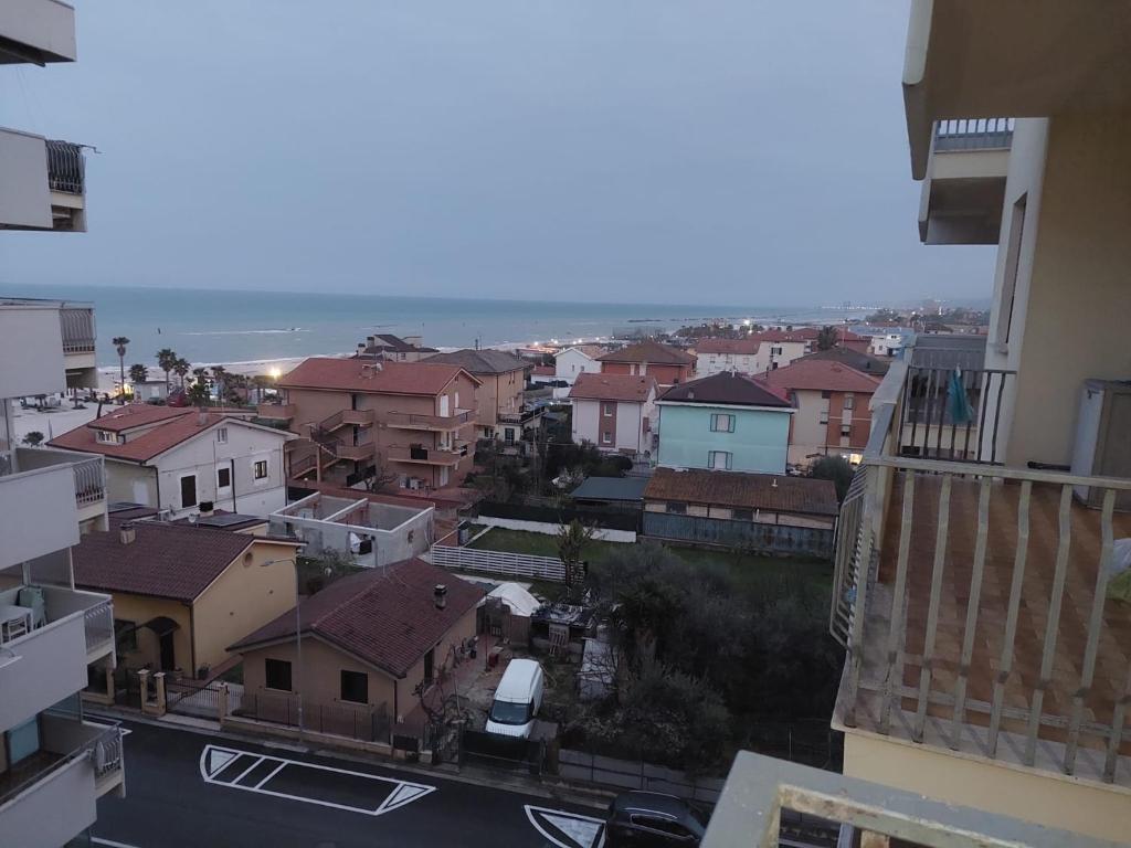 a view of a city with buildings and the ocean at DaSimo in Lido di Fermo
