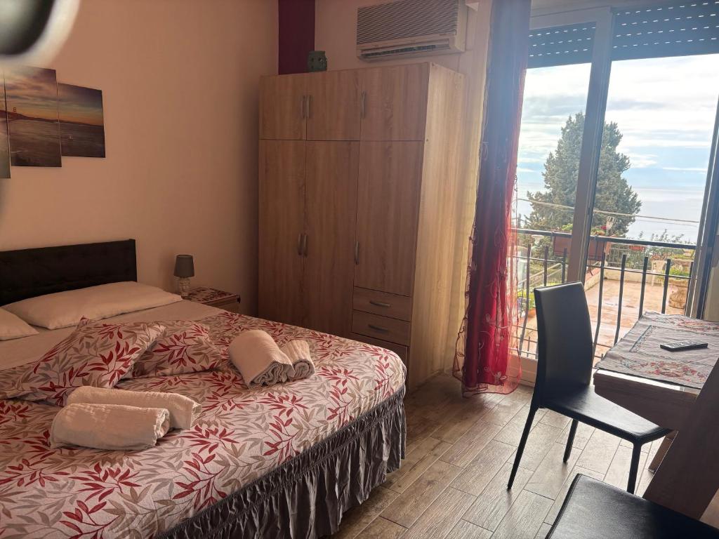a bedroom with a bed with two towels on it at B&B Antonella in Taormina