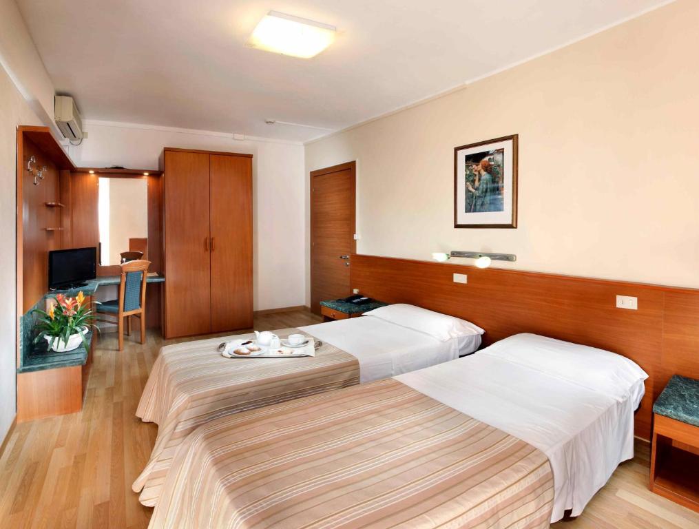 Postel nebo postele na pokoji v ubytování Hotel Bembo