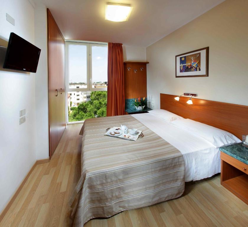 Postel nebo postele na pokoji v ubytování Hotel Bembo