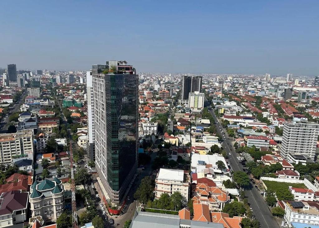 an overhead view of a city with a tall building at Modern Condo in Phnom Penh ByDN in Phnom Penh