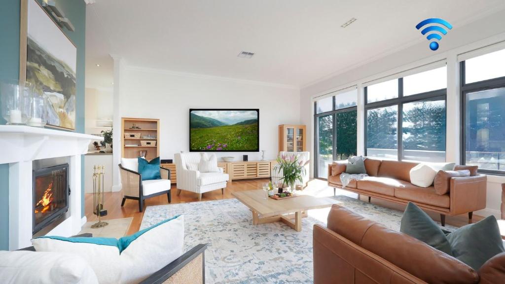a living room with a couch and a fireplace at Silos in East Kangaloon