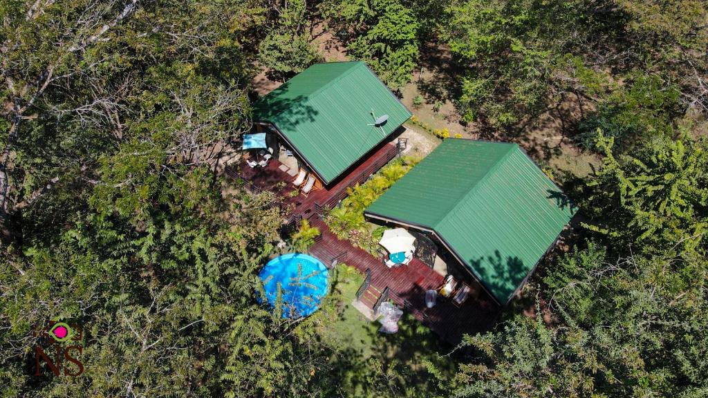 an overhead view of a house with two green roofs at Nicoya Silvestre in Lepanto