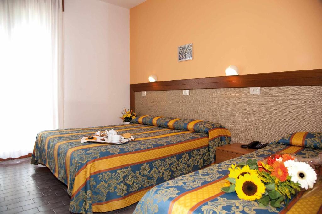 Postel nebo postele na pokoji v ubytování Hotel Bettina