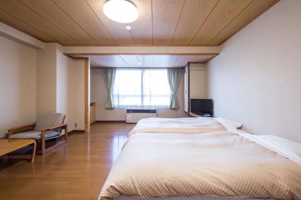 Postel nebo postele na pokoji v ubytování Hotel Goryukan