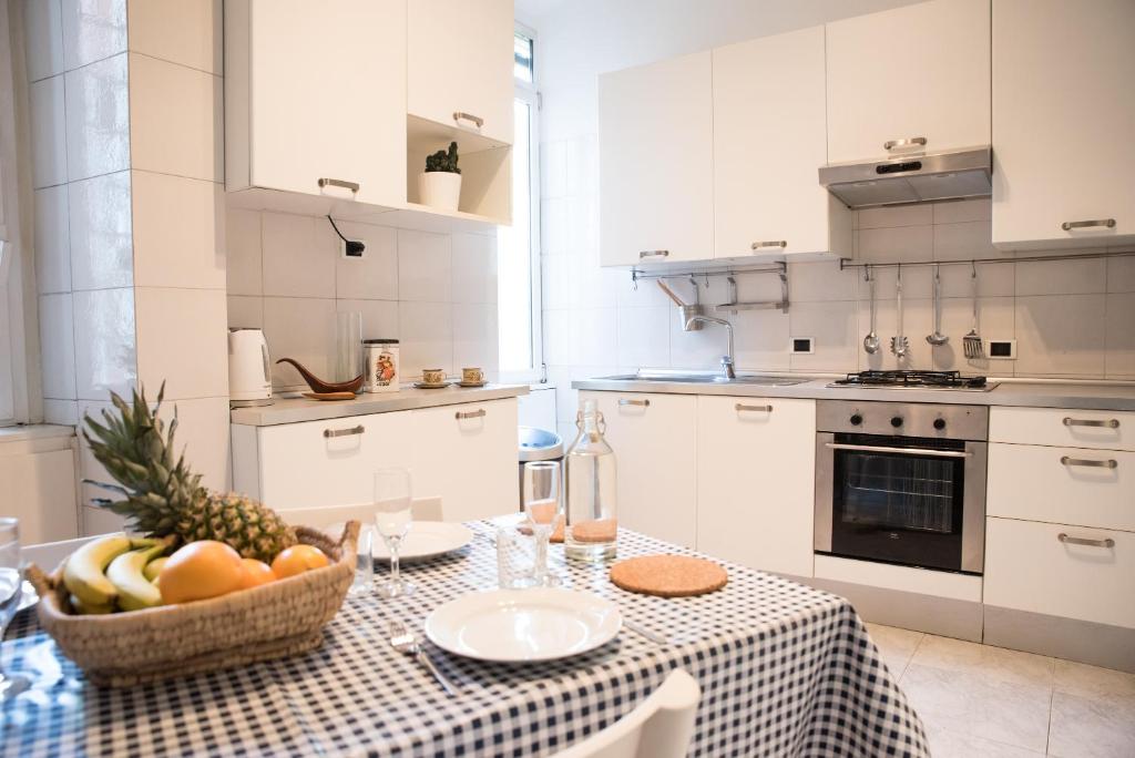 A kitchen or kitchenette at Porta Latina Apartment