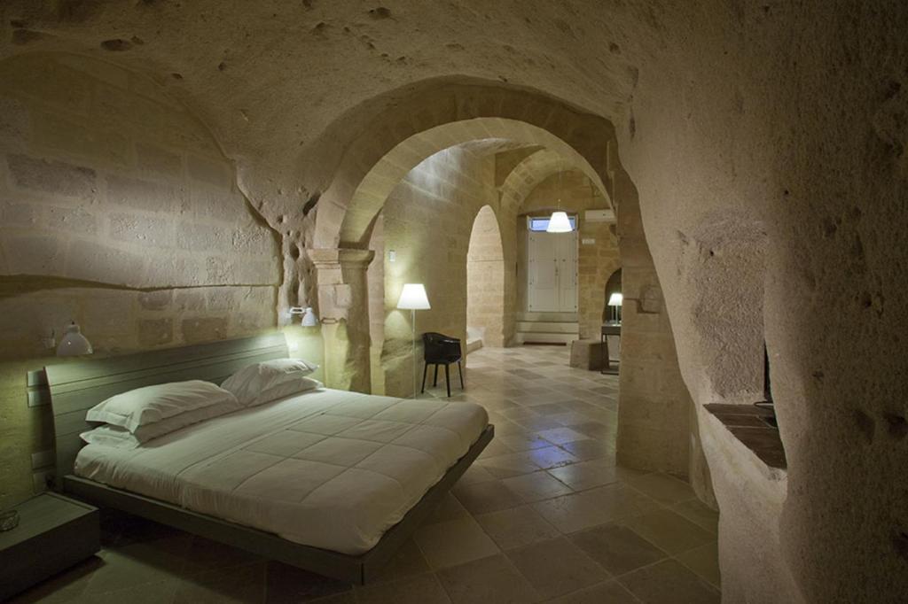 Postel nebo postele na pokoji v ubytování Antico Convicino Rooms Suites & SPA