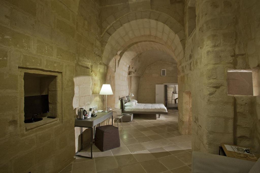 Postel nebo postele na pokoji v ubytování Antico Convicino Rooms Suites & SPA