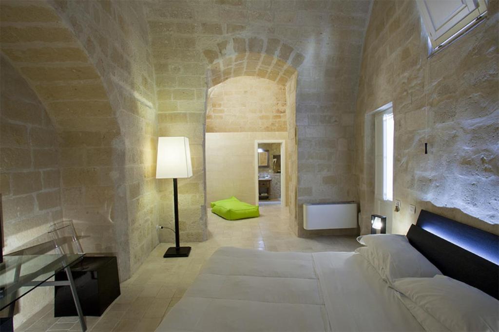 Postel nebo postele na pokoji v ubytování Antico Convicino Rooms Suites & SPA
