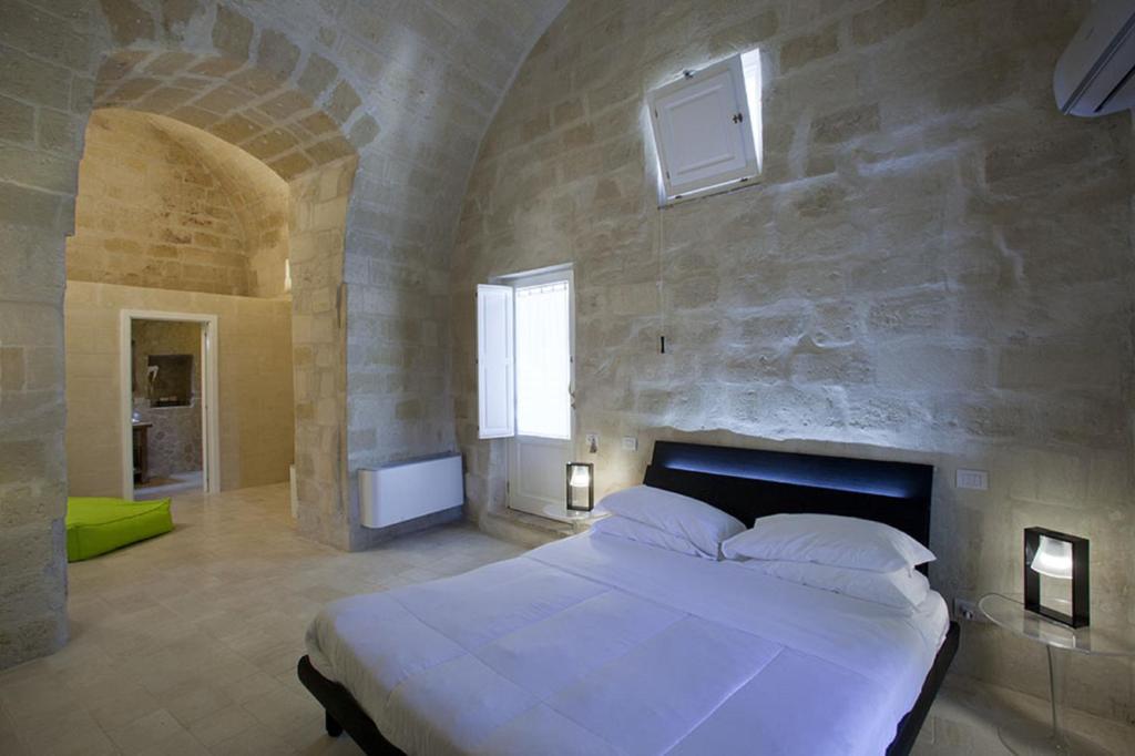 Postel nebo postele na pokoji v ubytování Antico Convicino Rooms Suites & SPA