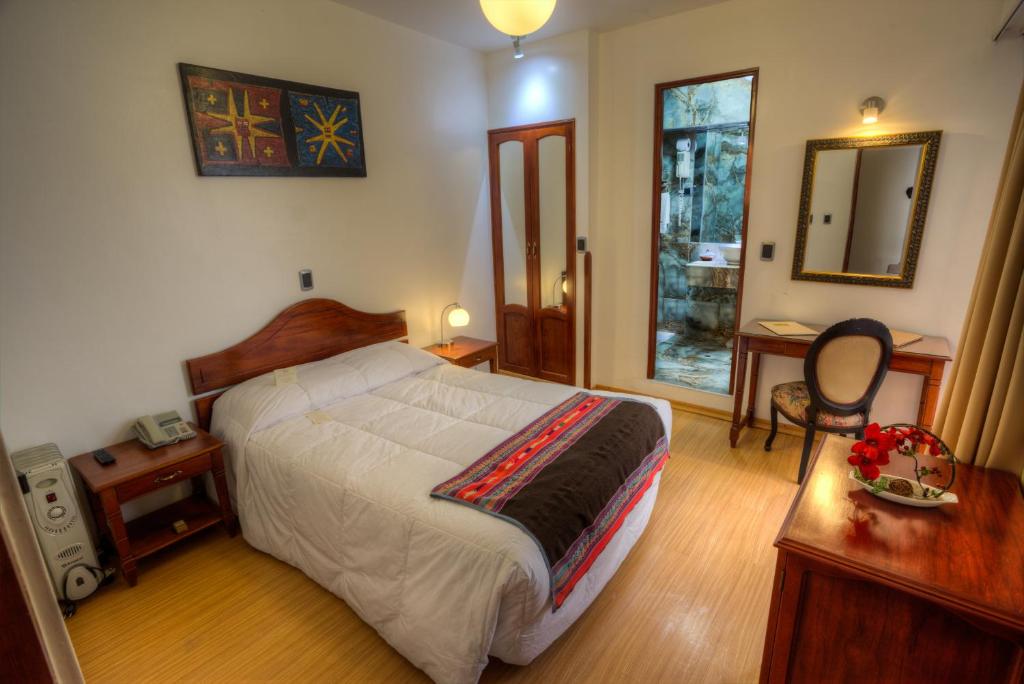 Postel nebo postele na pokoji v ubytování Hotel Ruinas