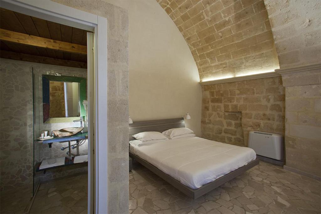 Postel nebo postele na pokoji v ubytování Antico Convicino Rooms Suites & SPA