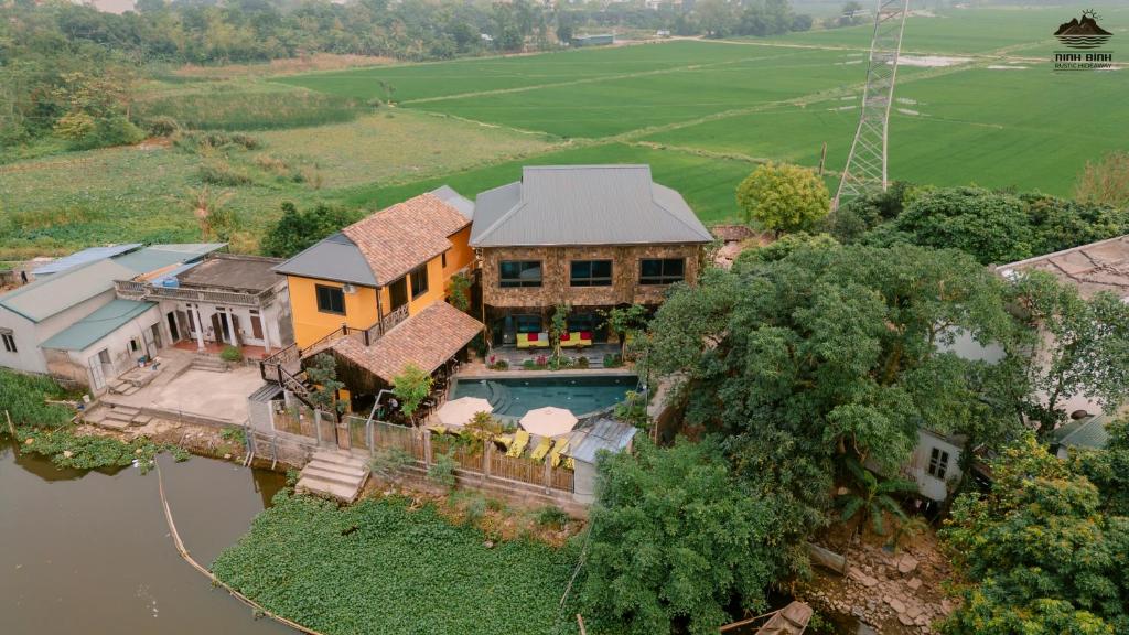 an aerial view of a house with a swimming pool at Trang An Ninh Binh Rustic Hideaway in Ninh Binh