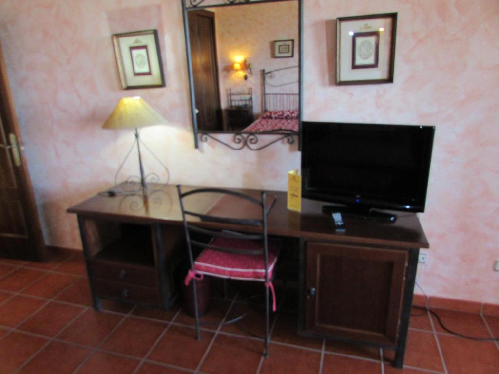 TV a/nebo společenská místnost v ubytování Hotel Real Castillo