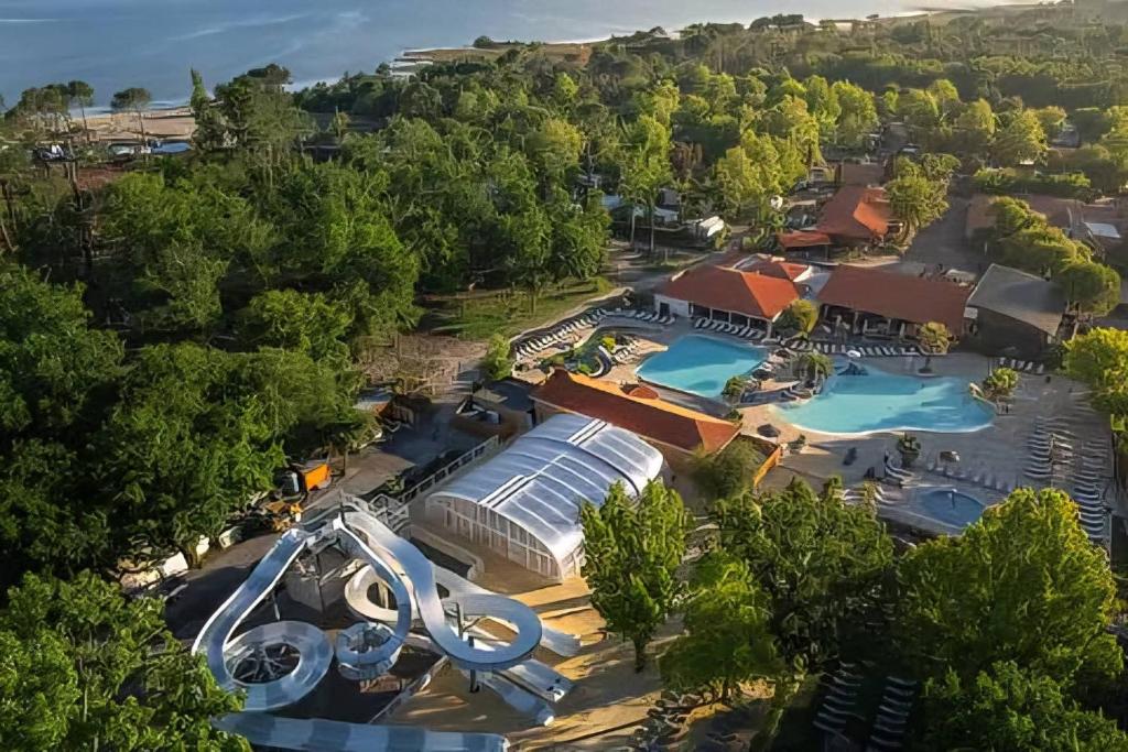 an overhead view of a resort with two pools at Camping Mayotte, Biscarosse in Biscarrosse