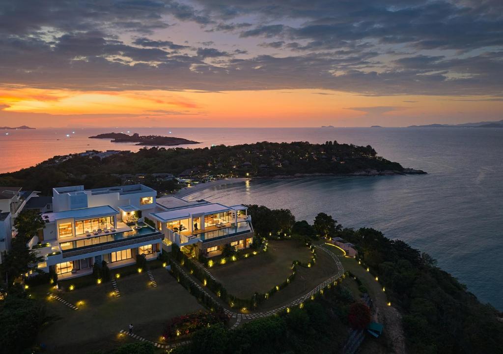 an aerial view of a large building with lights at Cape Azure Resort Samui by Thalsea in Plai Laem