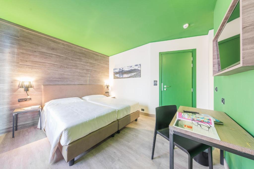 Postel nebo postele na pokoji v ubytování Hotel Europa