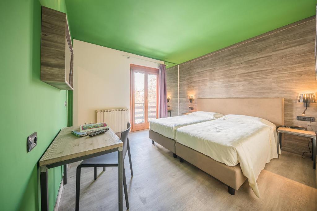 Postel nebo postele na pokoji v ubytování Hotel Europa