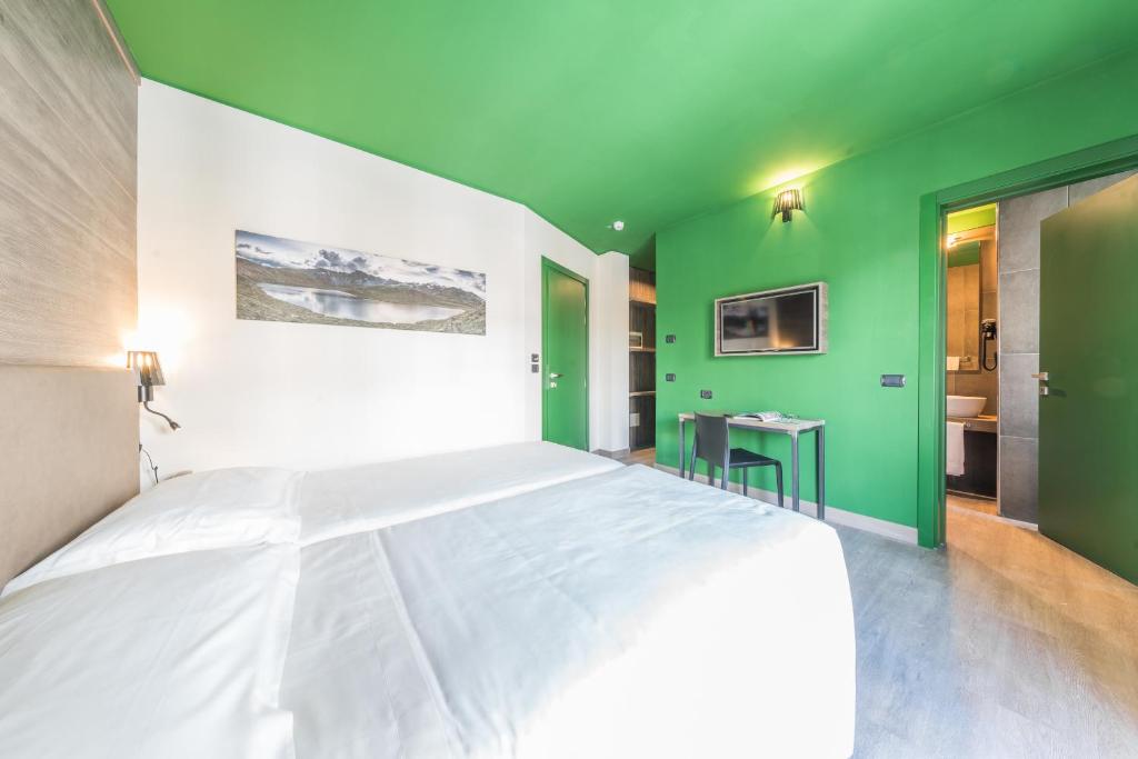 Postel nebo postele na pokoji v ubytování Hotel Europa