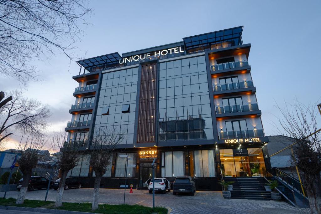 a hotel with a sign that reads unique hotel at UNIQUE Airport Hotel in Tashkent