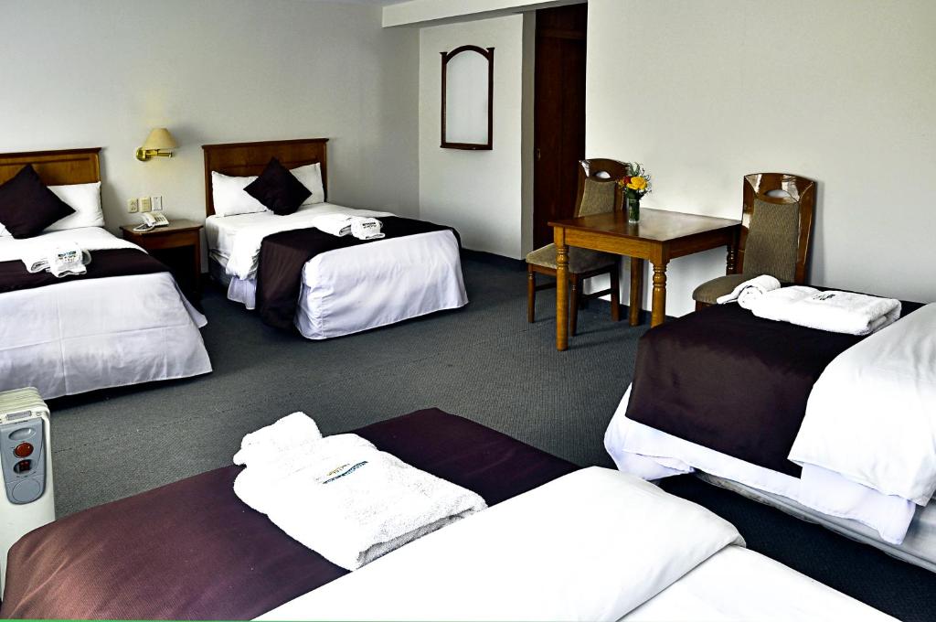 Cama o camas de una habitación en Casona Plaza Hotel Puno