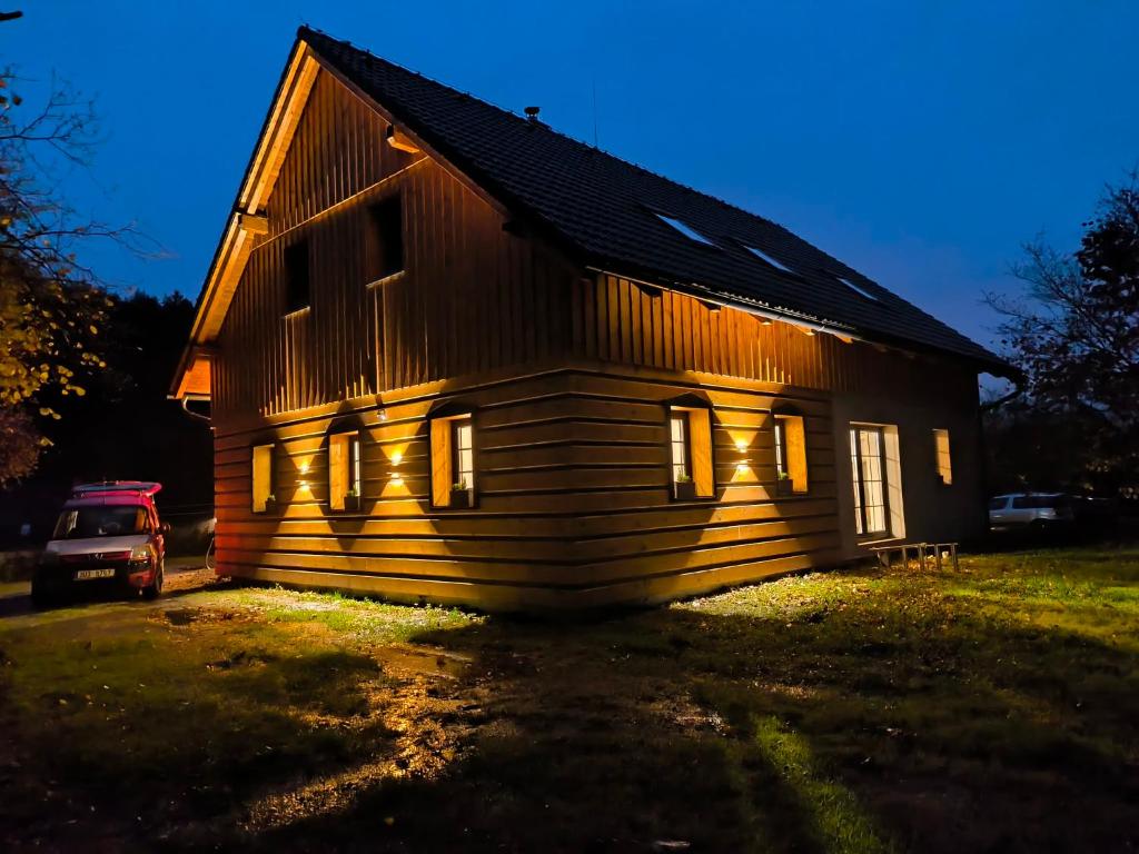 a house with a car parked in front of it at Chalupa na Kopci in Liberec