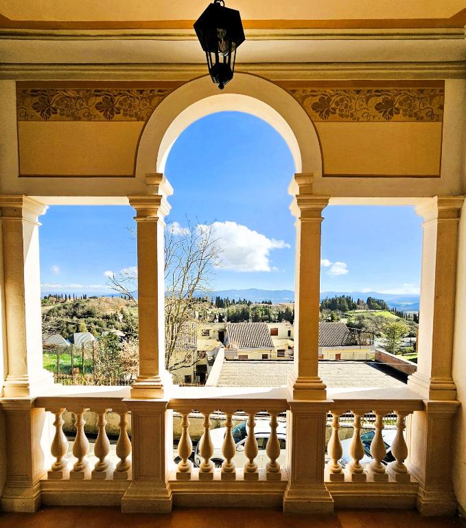 a view from the balcony of a building at Villa Palazzo Delle Erbe in Casole dʼElsa