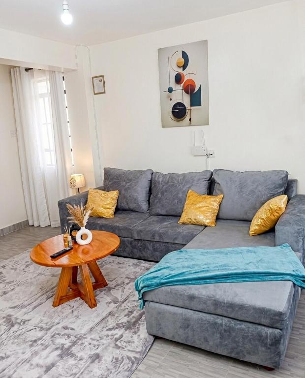a living room with a couch and a table at Esidai Sidai in Narok