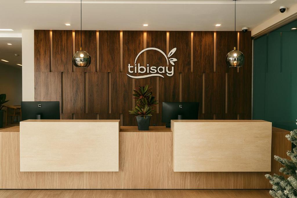 a lobby with two reception desks and a sign at Tibisay Hotel Boutique Morrocoy in Tucacas