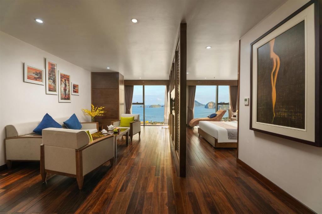 a living room with a couch and a table at Cat Ba Paradise Hotel - Sky Bar & Massage in Cat Ba