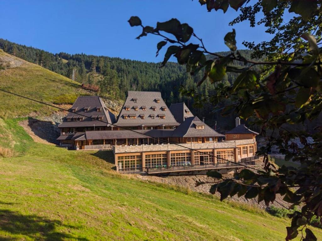 a large building on top of a hill at Smeštaj Iver in Mokra Gora